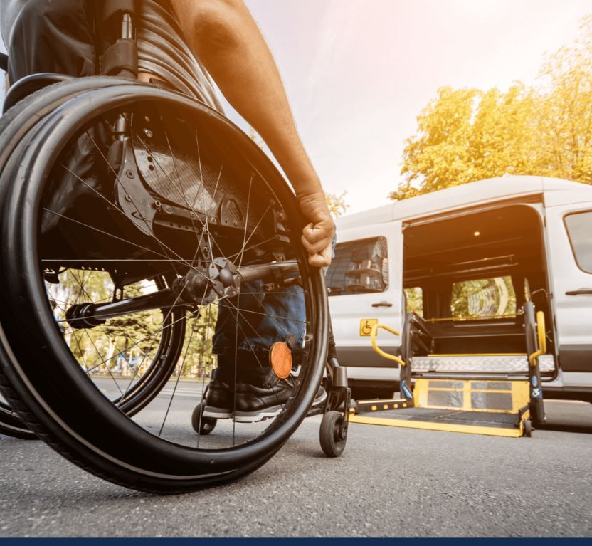 injury victim in a wheelchair entering a transport van
