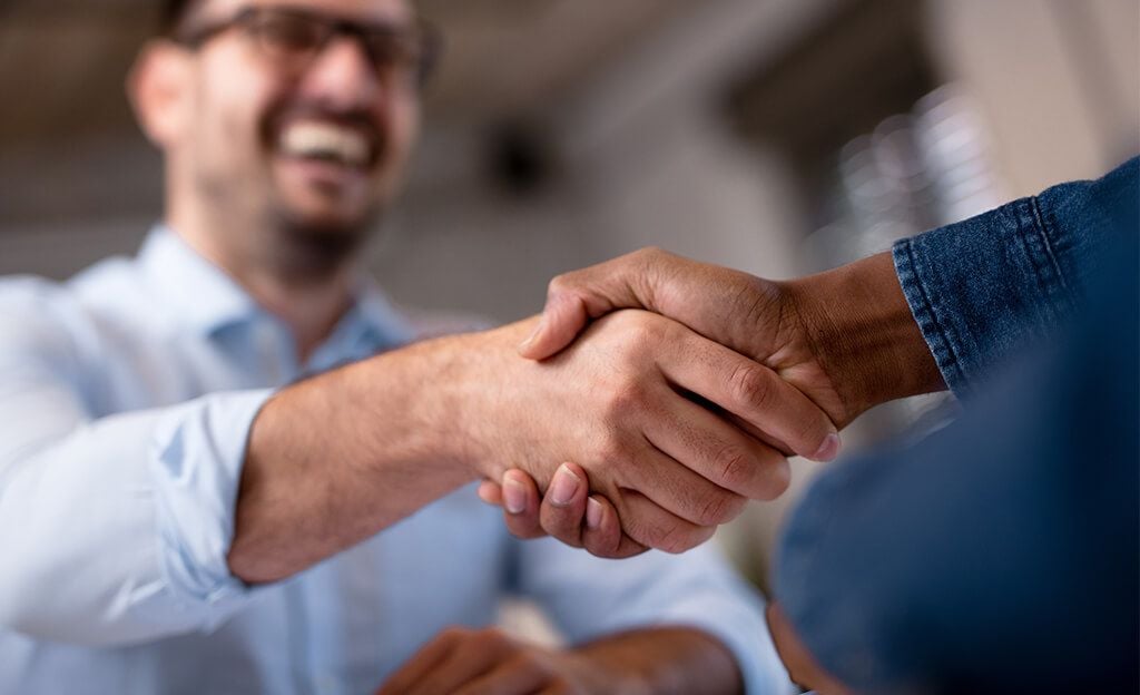 shaking hands with a disability lawyer